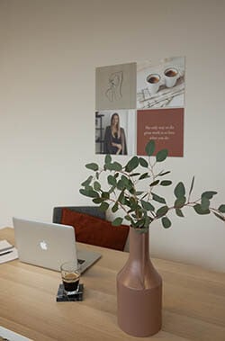 Squares above a desk with vase